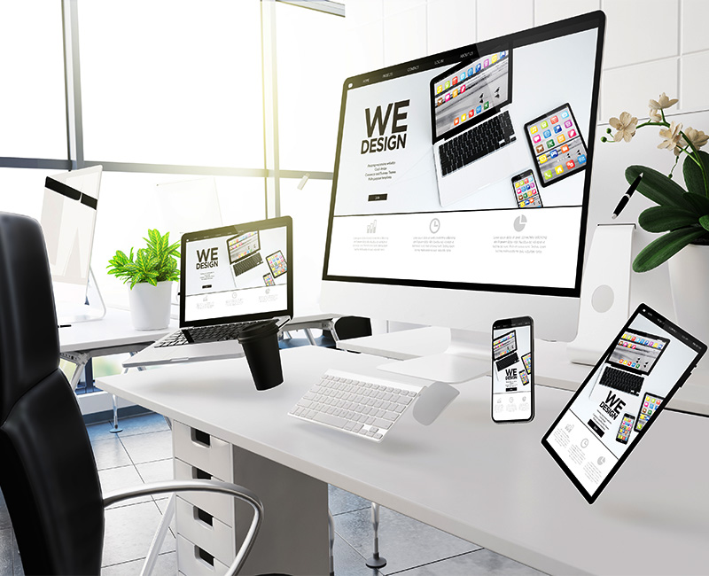 Image of devices floating above a desk, showing good responsive design