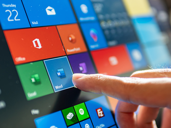 User touching Windows 10 MS Word icon